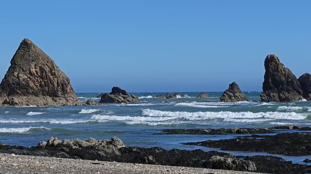 Ireland Epic Locations beach scene deep blue sky surf reefs and pebble beach at low tide Copper Coast Waterford Ireland in Summer