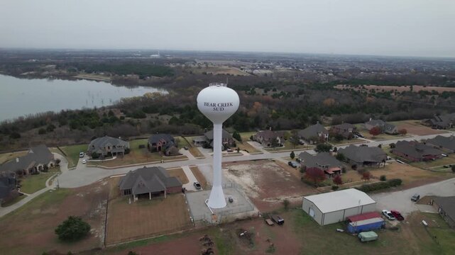 Aerial video of a water tower near Lake Lavon for the Bear Creek SUD Special Utility District.