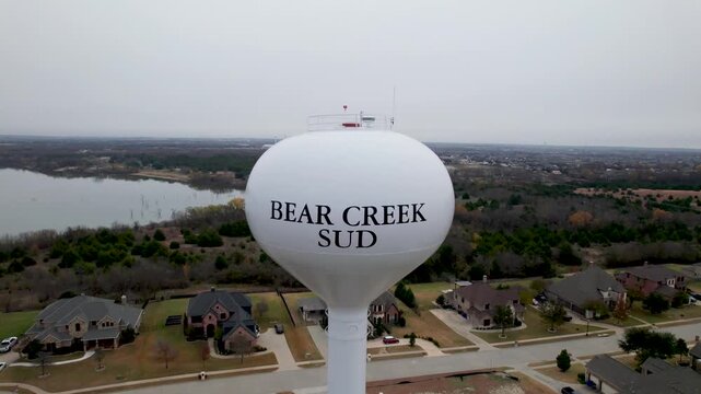 Aerial video of a water tower near Lake Lavon for the Bear Creek SUD. Camera approaches slowly and close up.