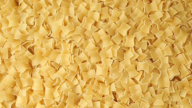 Uncooked raw quadretti pasta background texture