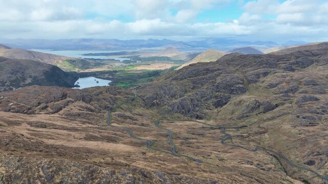 Ireland stunning aerial of Healey Pass on The Cork Kerry border looking over Kenmare Bay epic road trip on the wild Atlantic way