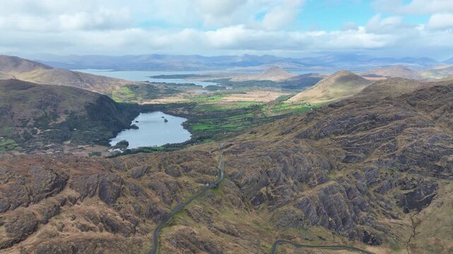 Drone view over The Healey Pass with the expanse of Co Kerry and Kenmare Bay epic locations Ireland in summer