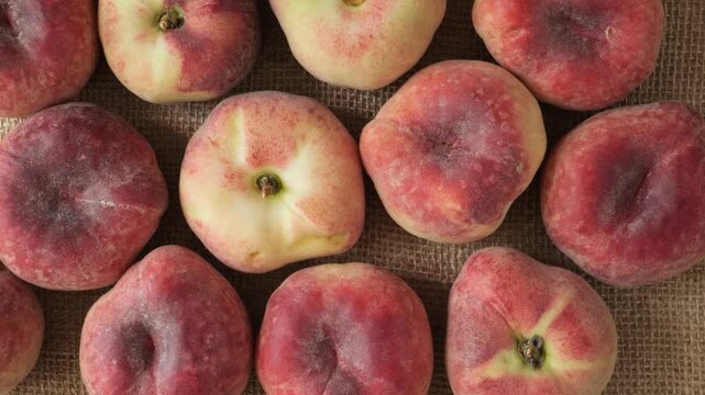 Fresh donut peaches on a rustic background