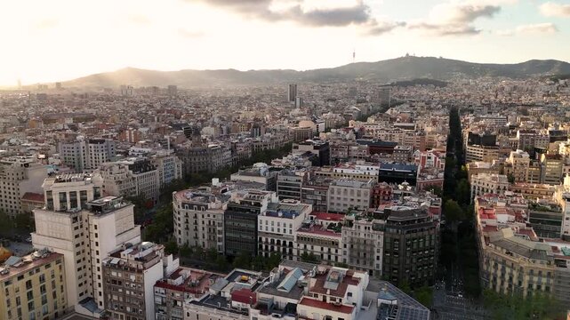 Drone Shot, Sunset Above Barcelona Spain, City Center Buildings and Streets