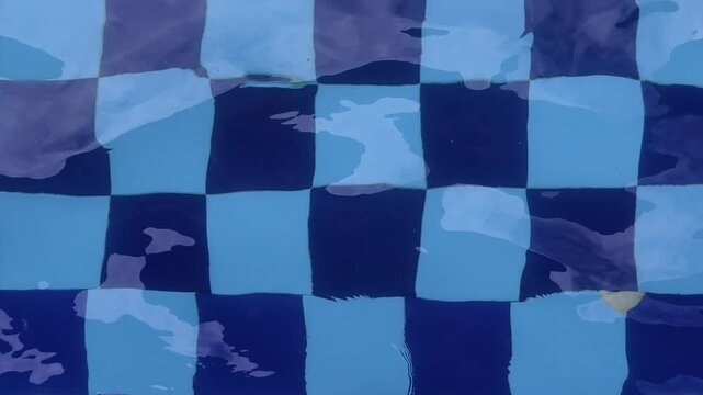Blue checkered pattern on the bottom of the swimming pool, part 1