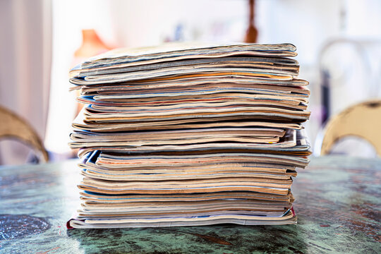 Stack of old magazines on a table