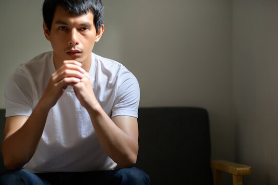 Thoughtful Man in Calm Space with Natural Light and Soft Shadows