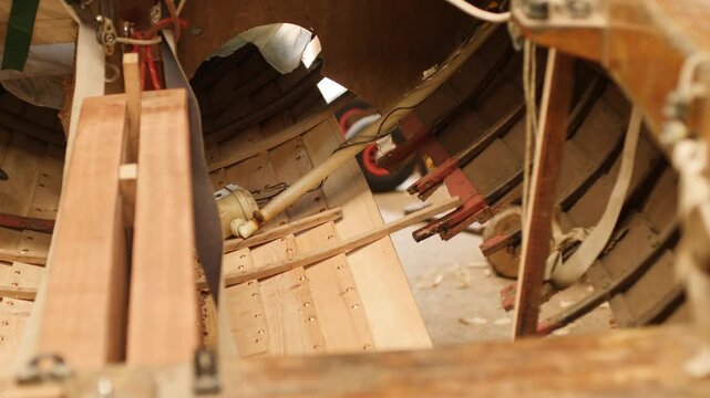 interior repaired copper riveted planking on clinker sailboat