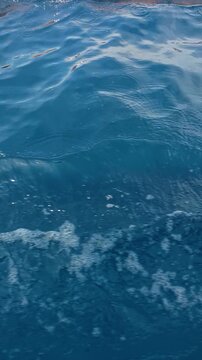 Close-up Of Blue Ocean Water With Bubbles