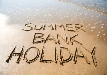 Summer bank holiday written in sand beach.