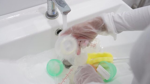 Close Up of Sanitizing Baby Feeding Bottles for Safe Infant Care and Daily Hygiene