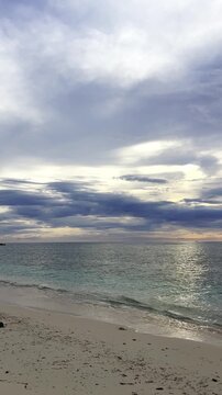 Beach Shoreline Under Cloudy Sky