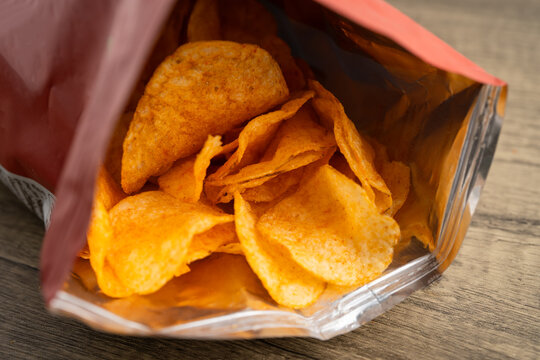 Potato chips , delicious BBQ seasoning spicy for crips, thin slice deep fried snack fast food.