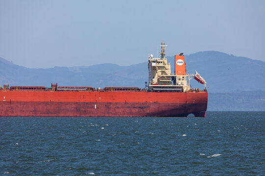 Astoria, Oregon, USA - July 5, 2026: Close-up of commercial bulk carrier trade ship PAN PEGASUS operated by PAN Ocean anchored on the Columbia River near the Pacific Ocean