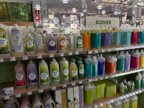 Mallorca, spain, july 06, 2026, sodasan and sonett eco friendly cleaning products filling shelves in a modern supermarket organic department