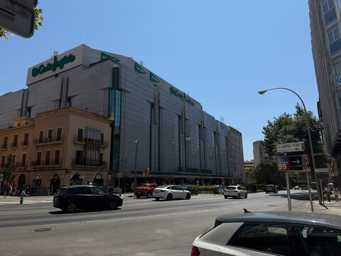 Mallorca, spain, july 06, 2026, el corte ingles department store building in palma de mallorca, spain, with cars driving on a busy city street