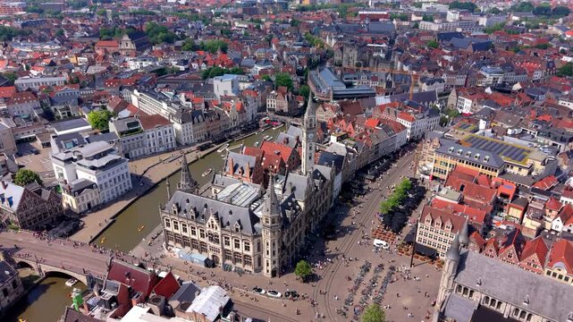 Aerial wide angle panoramic view of the historic old post office building clock tower river canal bridges public squares and red tiled city roofs under a bright summer sky