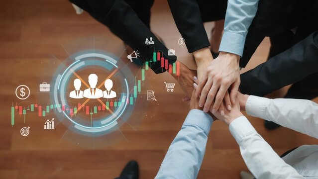 Business team stacking hands together in unity with digital marketing icons overlay