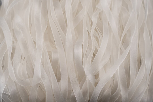 Green bean noodles background texture. Glass noodles pattern surface. Macro shot