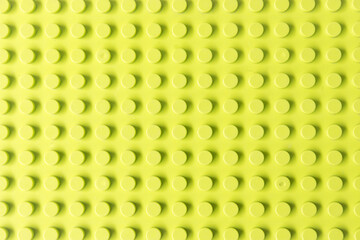 Bright Yellowish Green plastic toy construction background. Seamless Lime green building block base plate    © Ilen Studio