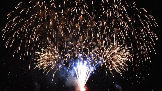 Colorful fireworks display with bright explosions and sparkles in the night sky for celebration