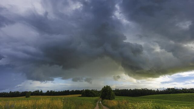 Storm clouds moving in a Timelapse. Summer storm with cumulus clouds and rain