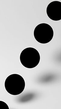Black geometric circles with shadows on white.