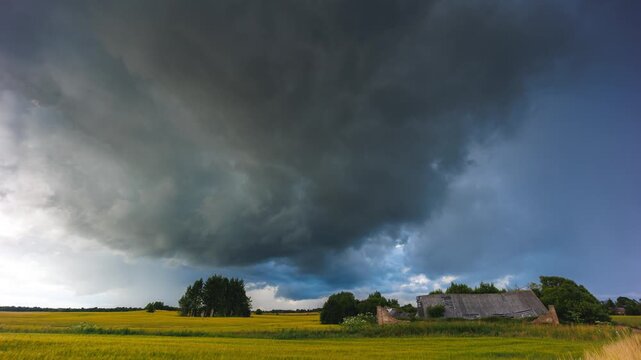 Storm clouds moving in a Timelapse. Summer storm with cumulus clouds and rain
