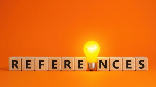 Business references concept with wooden blocks and a yellow light bulb on an orange background.