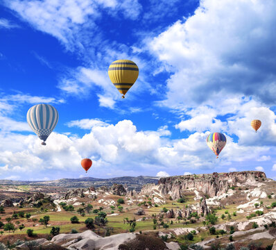 Balloon flight, famous tourist attraction of Cappadocia. Air balloons and Fairy Chimney in Pasabag Valley, Anatolia, Turkey. Topic of vacation, travel, trip abroad on vacation, cruises and tours