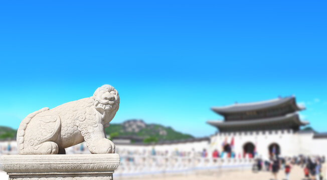 Horizontal banner with statue of mythical creature at Gwanghwamun Gate. View of Gyeongbokgung palace and Inwangsan Mountain, Seoul, South Korea. Topic of summer vacation, travel, cruises and tours