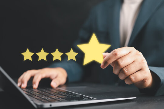 Five star customer satisfaction and service rating concept with businessman giving top review score. Symbol of quality service, client feedback, reputation and business excellence.