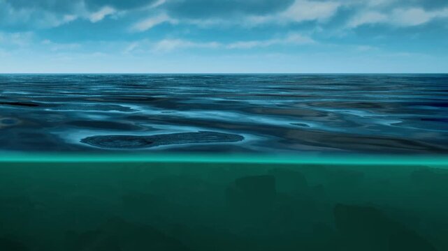 The ocean shows a calm surface with shadows below the water. The scene is bright and clear, highlighting the movement of the water and the sky above.