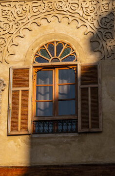 Ornate traditional window with detailed plasterwork trim