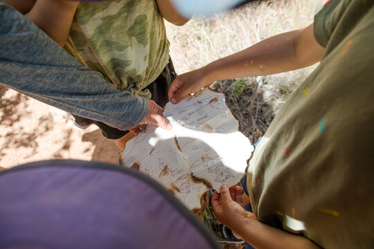 Children following a hand drawn pirate treasure map