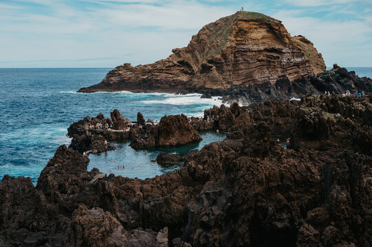 Natural volcanic pools at Porto Moniz with Ilh&eacute;u Mole, Madeira
