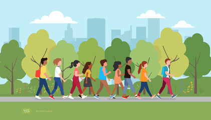 A diverse group of children walking together in a park with trees and a city skyline in the background.