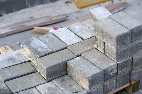 Stacked concrete pavers ready for construction project