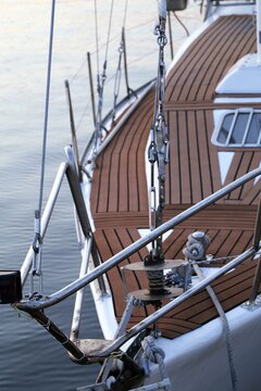 Sailboat bow with teak deck and rigging close up