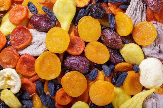 close up of mixed of dried fruits as background, top view