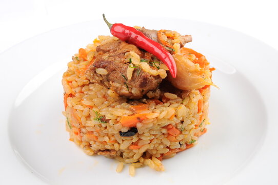Pilaf with Meat and Chili Pepper on White Plate