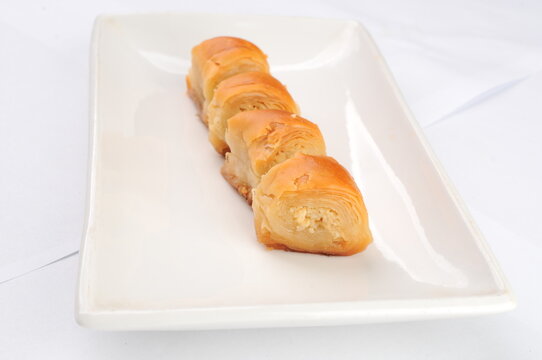 Four Pieces of Baklava on a White Plate