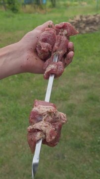 Preparing marinated pork shashlik for grilling