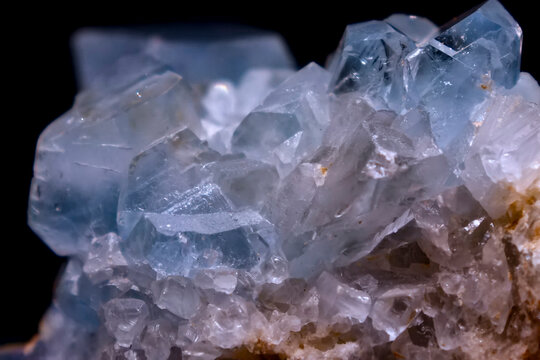 Macro detail of translucent pale blue celestite crystals with bright faceted reflections