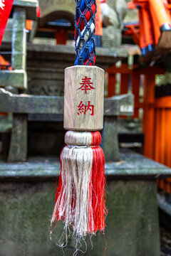 Suzu bell rope hanging at fushimi inari taisha shrine