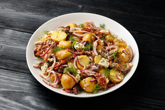 Greek Potato Salad with Feta Cheese, Kalamata Olives, Sun Dried Tomatoes and Red Onion