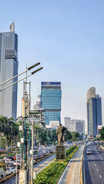 Jakarta, Indonesia, Dec-19, 2023: Traffic flows through Jakarta's central business district with modern skyscrapers, office towers and urban infrastructure in Indonesia's capital city.