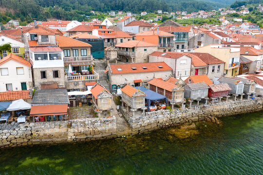 Aerial Drone View of the Coastline and Traditional Stone Horreos in the Historic Village of Combarro Galicia