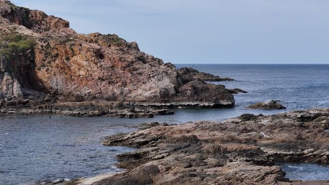 Drone footage captured with a 3&times; telephoto lens flying laterally at low altitude above offshore rock formations in Dak Lak (formerly Phu Yen) Province, Vietnam. The drone glides just above the sea roc