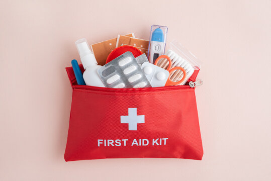 Red first aid kit bag with medical supplies